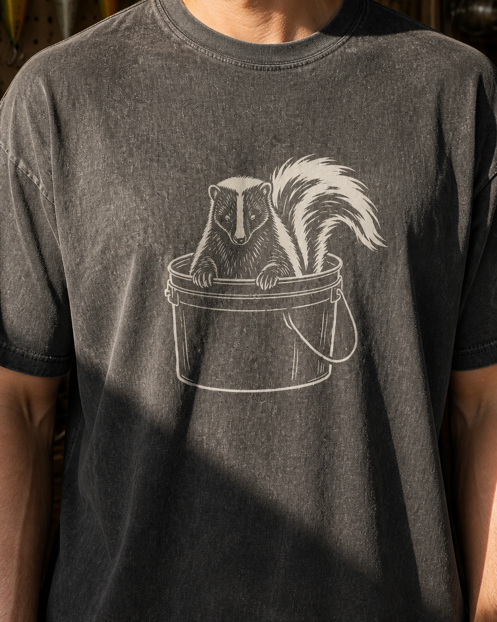 Bucket Skunk washed tee — washed black, worn, side
