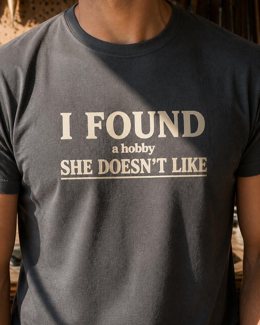 A Hobby She Doesn't Like tee — charcoal, worn, side
