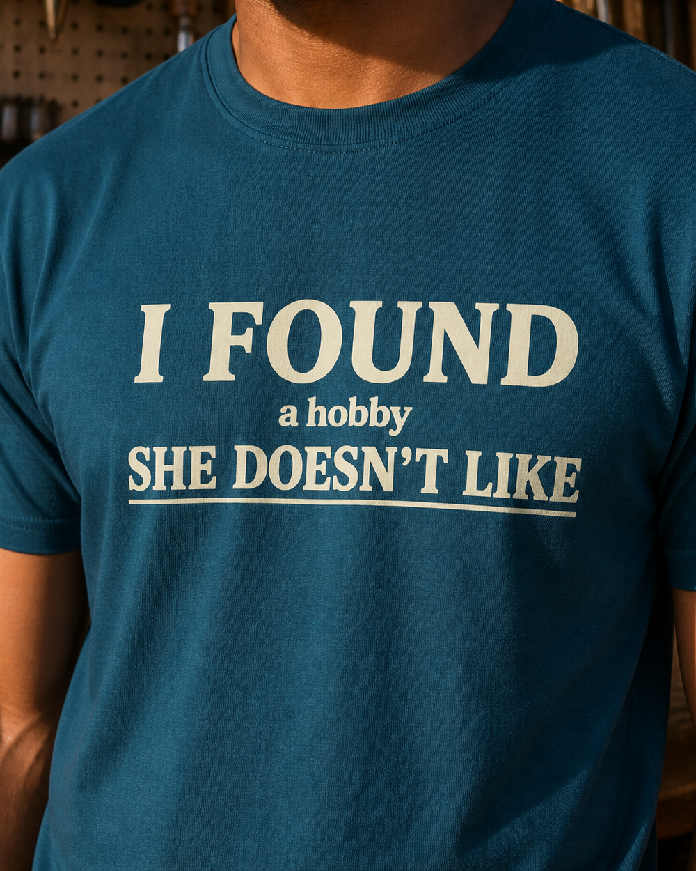 A Hobby She Doesn't Like tee — midnight navy, worn, side