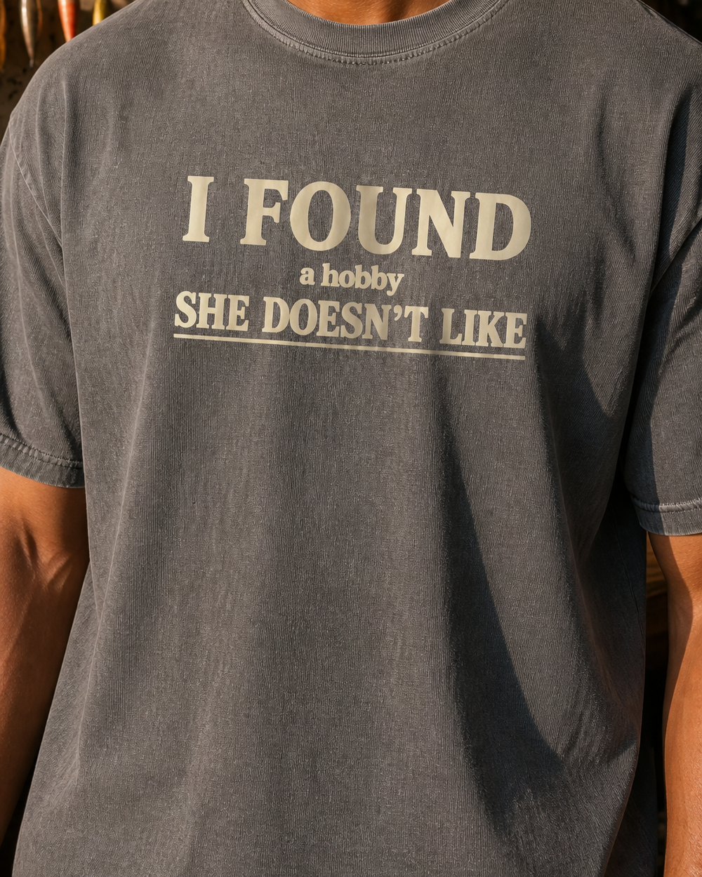 A Hobby She Doesn't Like washed tee — washed charcoal, worn, side