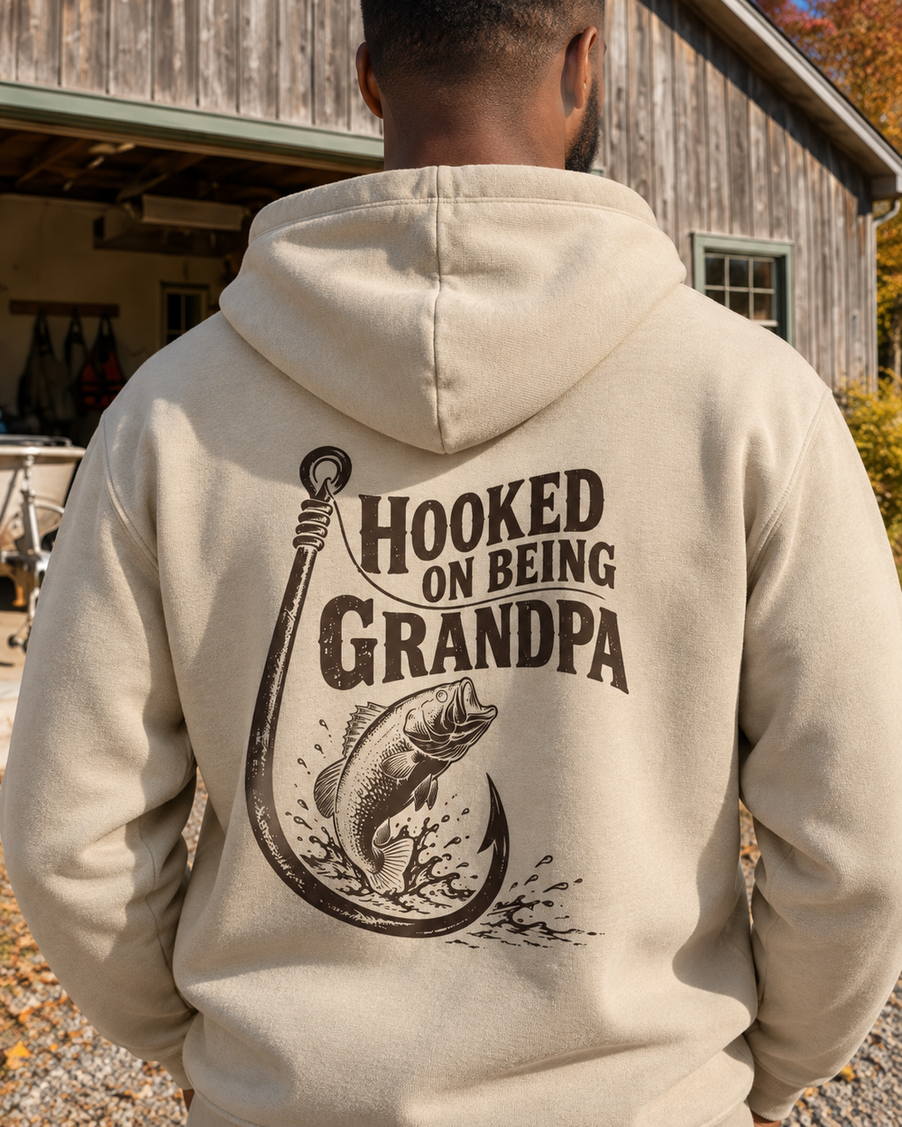Hooked On Being Grandpa Hoodie — Sand — model back close-up