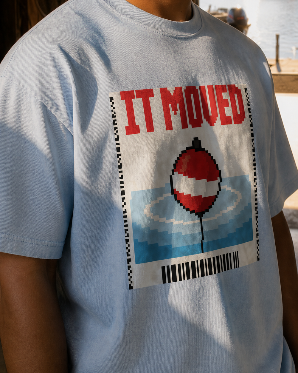 It Moved washed tee — washed light blue, worn, side
