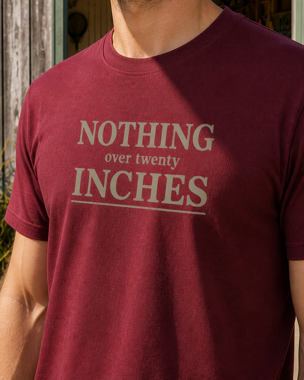 Nothing Over Twenty Inches Stacked tee — worn, side
