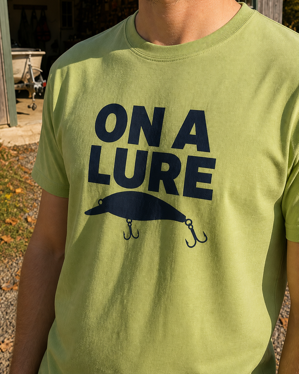 On A Lure Bold tee — kiwi, worn, side