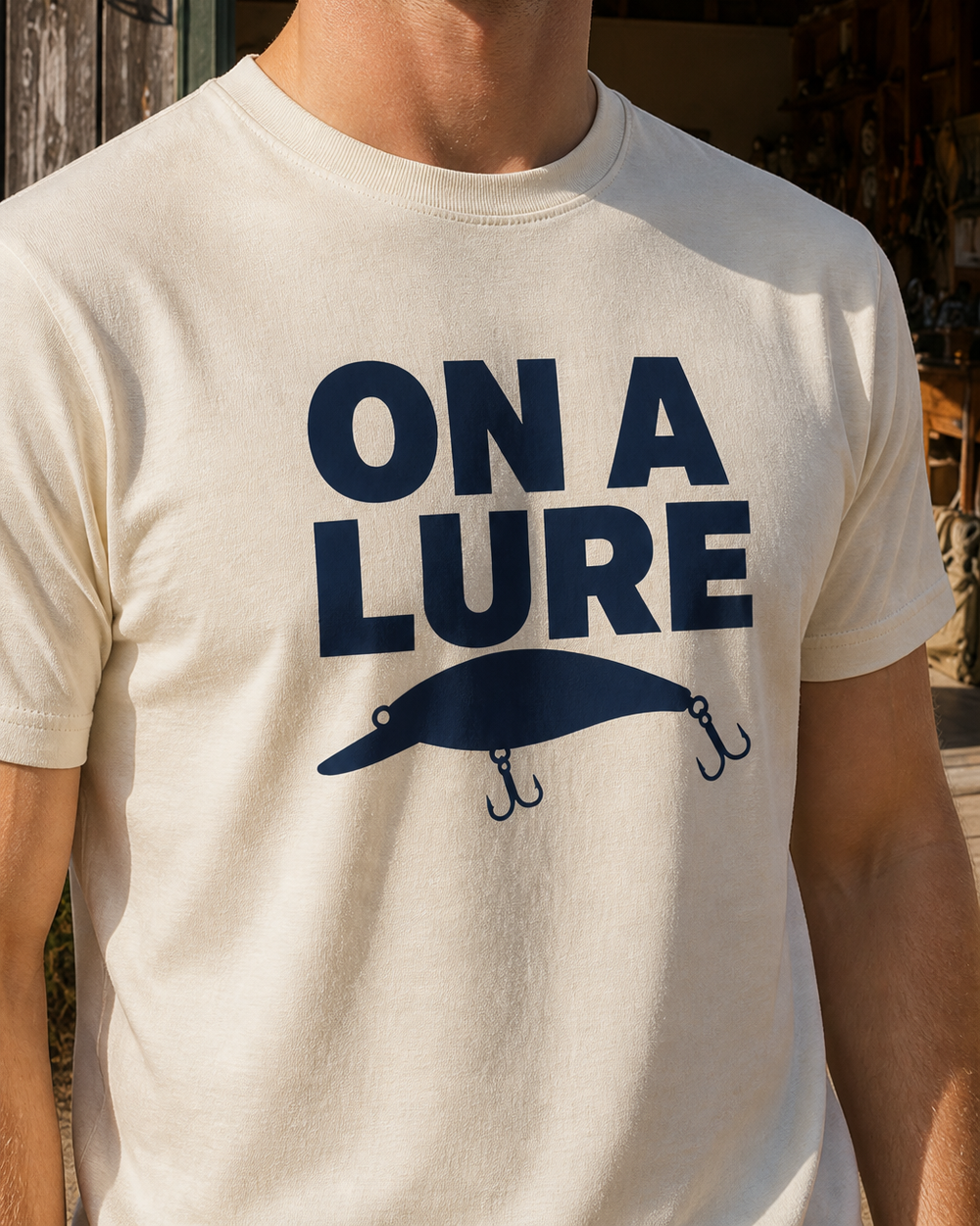 On A Lure Bold tee — bone, worn, side