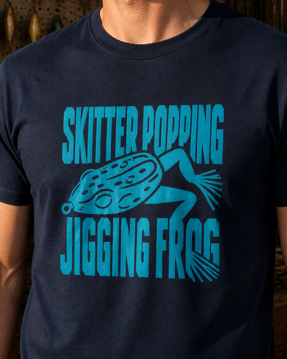 Skitter Popping Jigging Frog tee — navy, worn, side