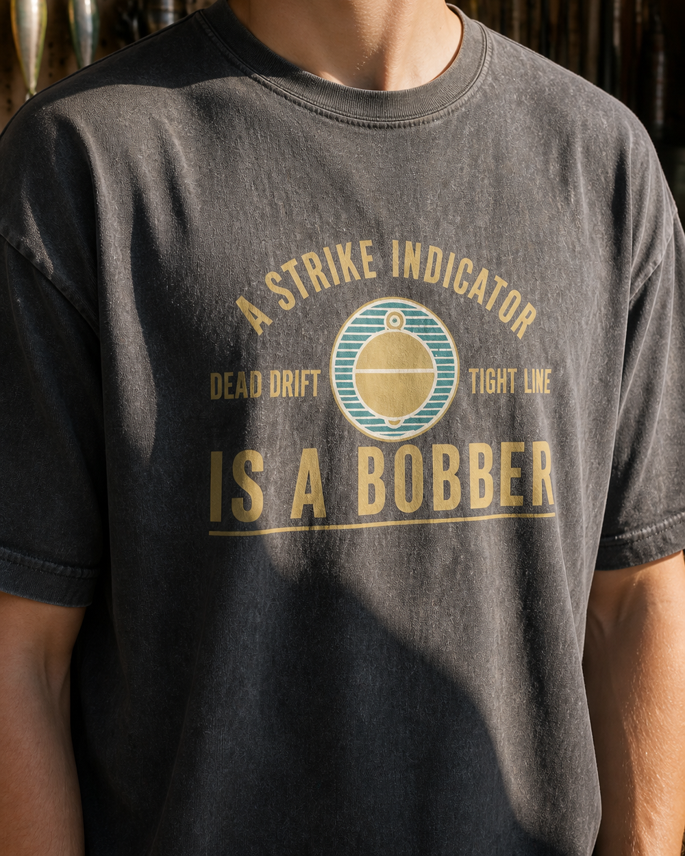 A Strike Indicator Is A Bobber washed tee — washed black, worn, side