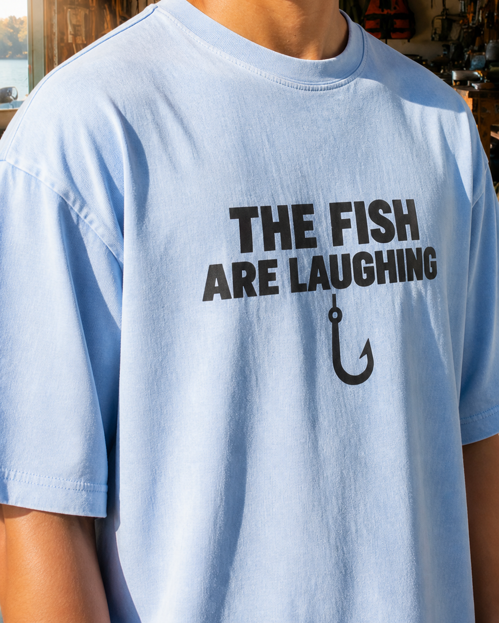 The Fish Are Laughing Bold washed tee — washed light blue, worn, side