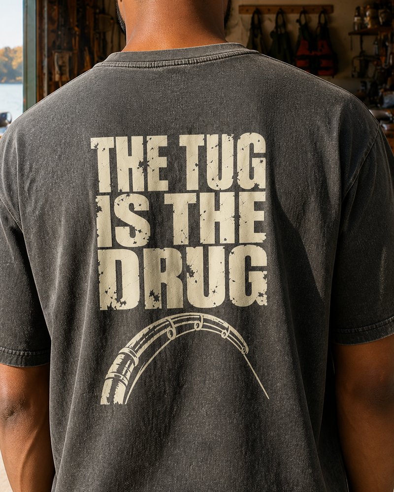 The Tug Is The Drug — Back Print washed tee — washed black, worn, back