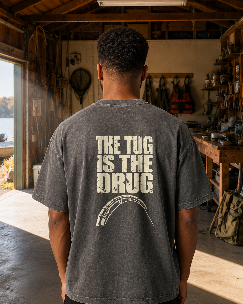The Tug Is The Drug — Back Print washed tee — washed black, worn, back