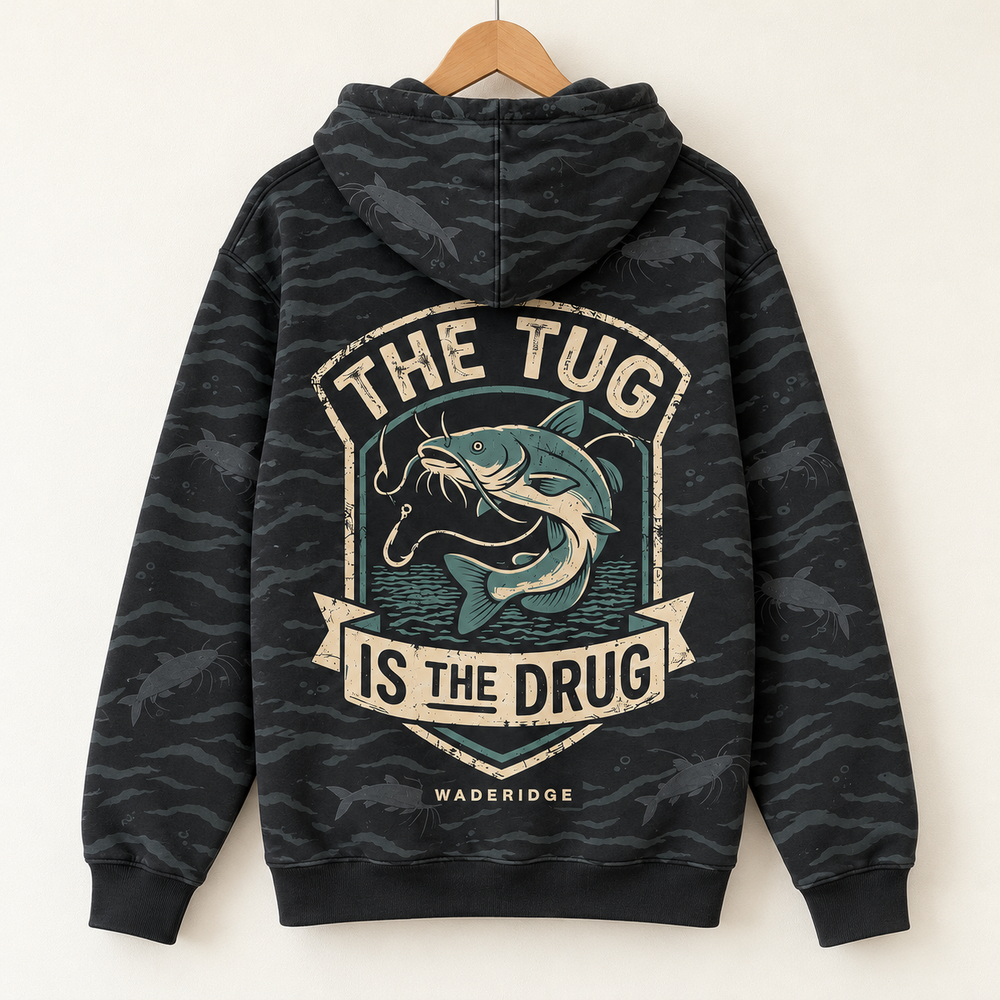 The Tug Is The Drug — Catfish Shield All-Over Print Hoodie — on a hanger