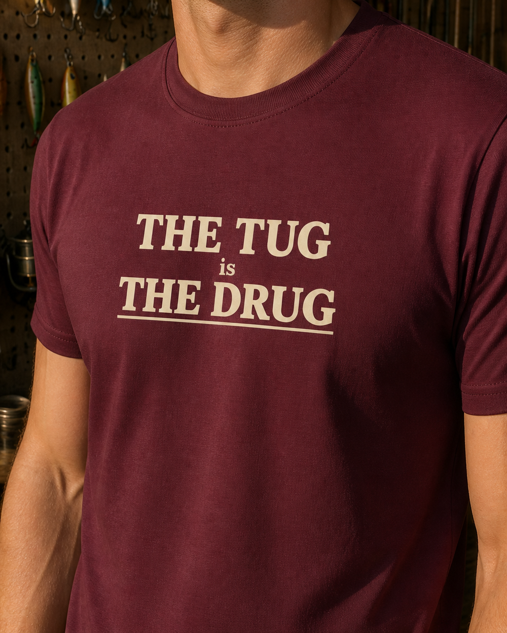 The Tug Is The Drug Stacked tee — maroon, worn, side