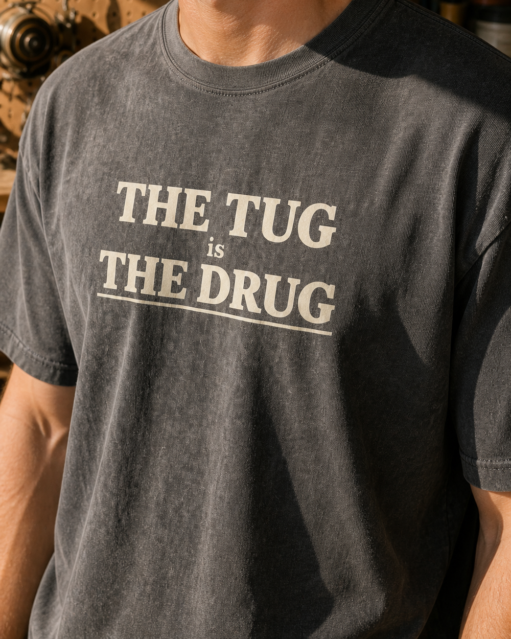 The Tug Is The Drug Stacked washed tee — washed black, worn, side