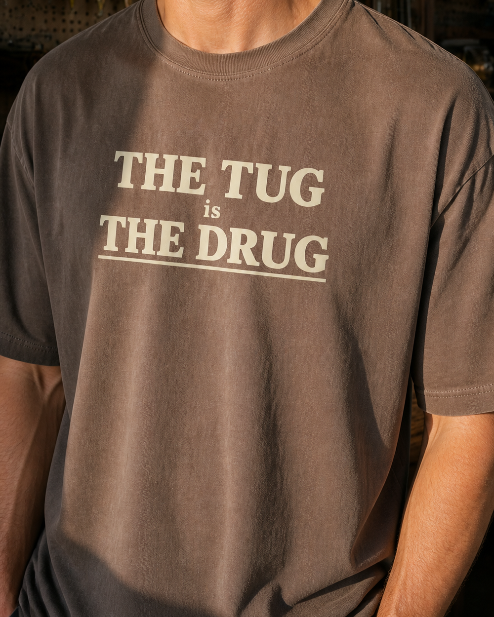 The Tug Is The Drug Stacked washed tee — washed coffee, worn, side