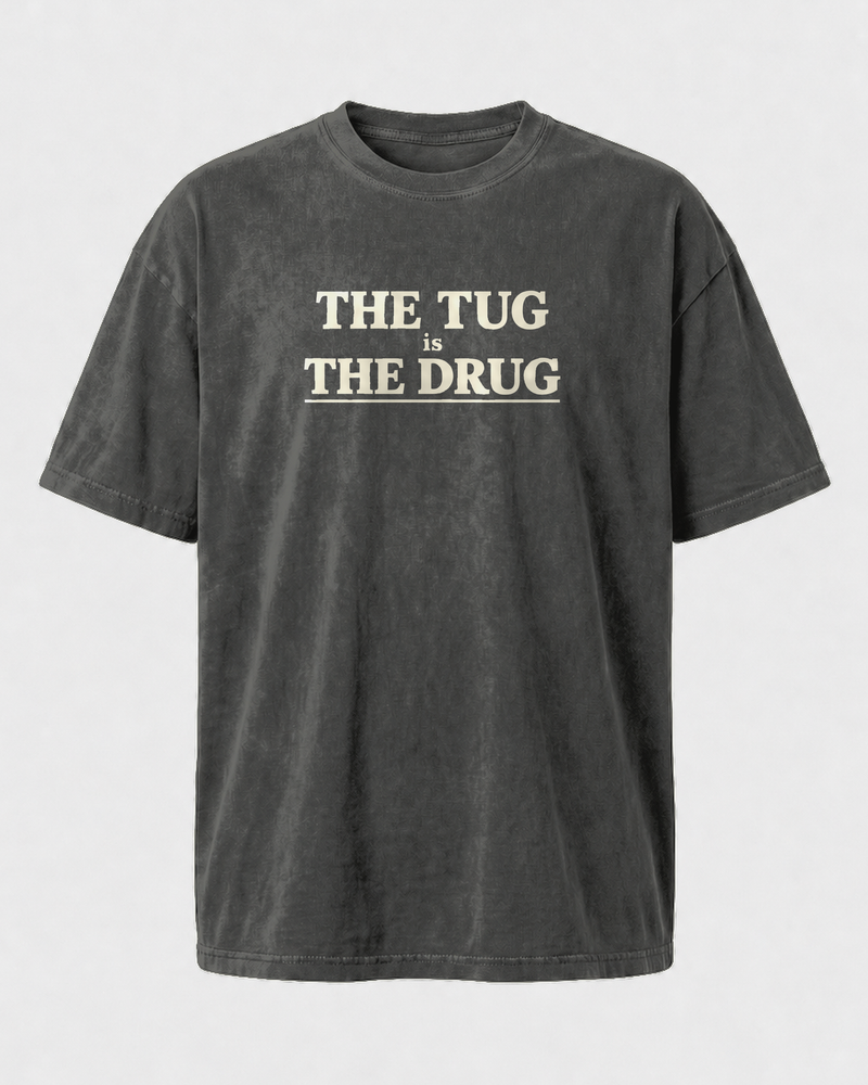 The Tug Is The Drug Stacked washed tee — washed black, front