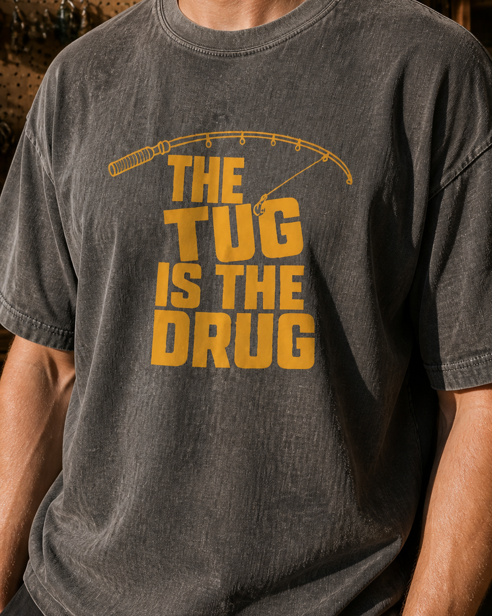 The Tug Is The Drug (free) washed tee — washed black, worn, side