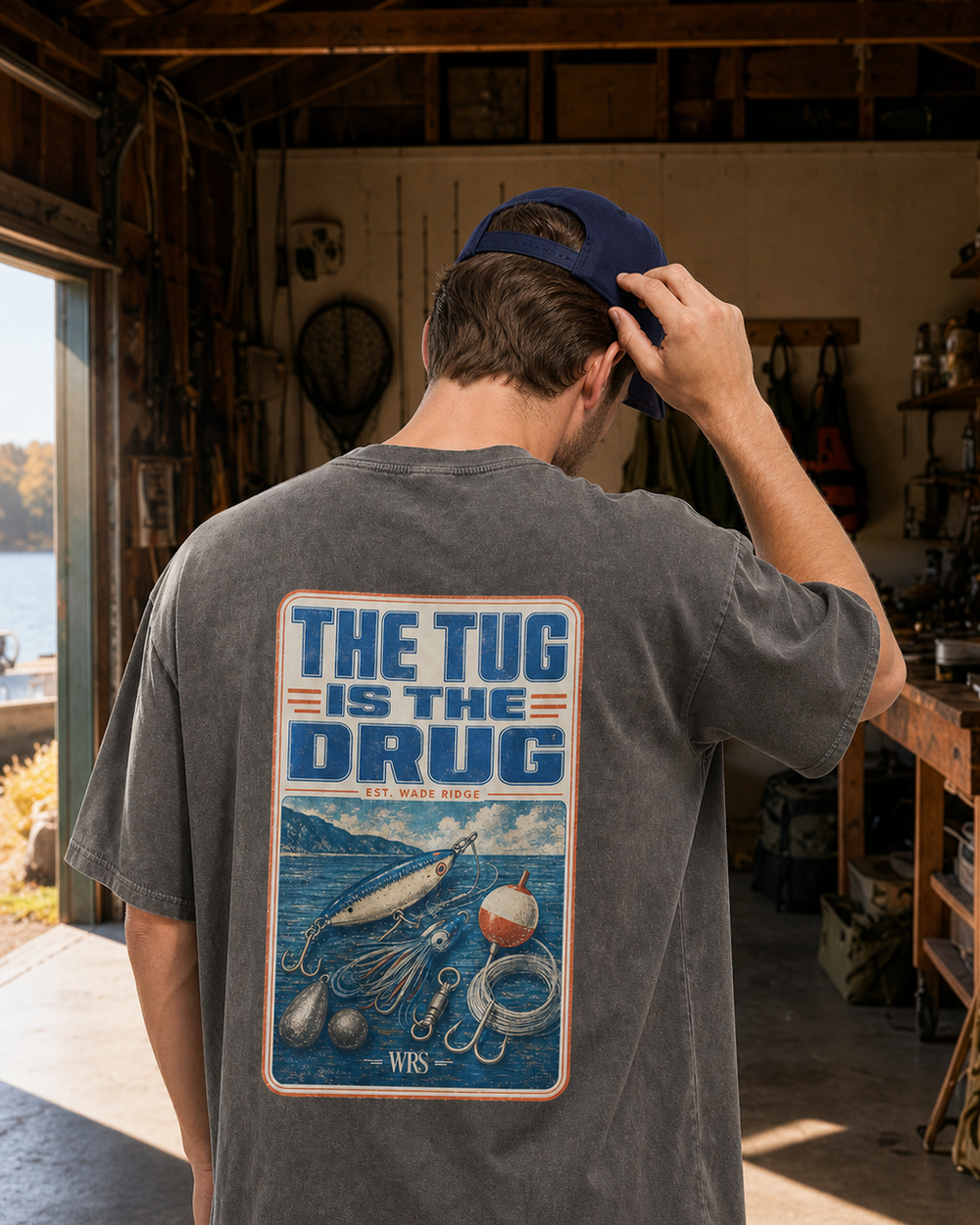 The Tug Is The Drug — Tackle Box Poster washed tee — washed black, worn, front