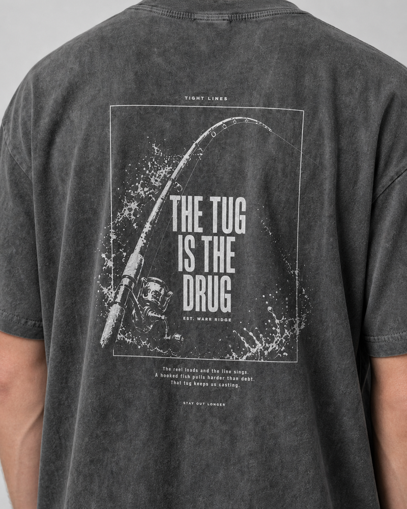 The Tug Is The Drug — Rod Under Load washed tee — washed black, worn, side