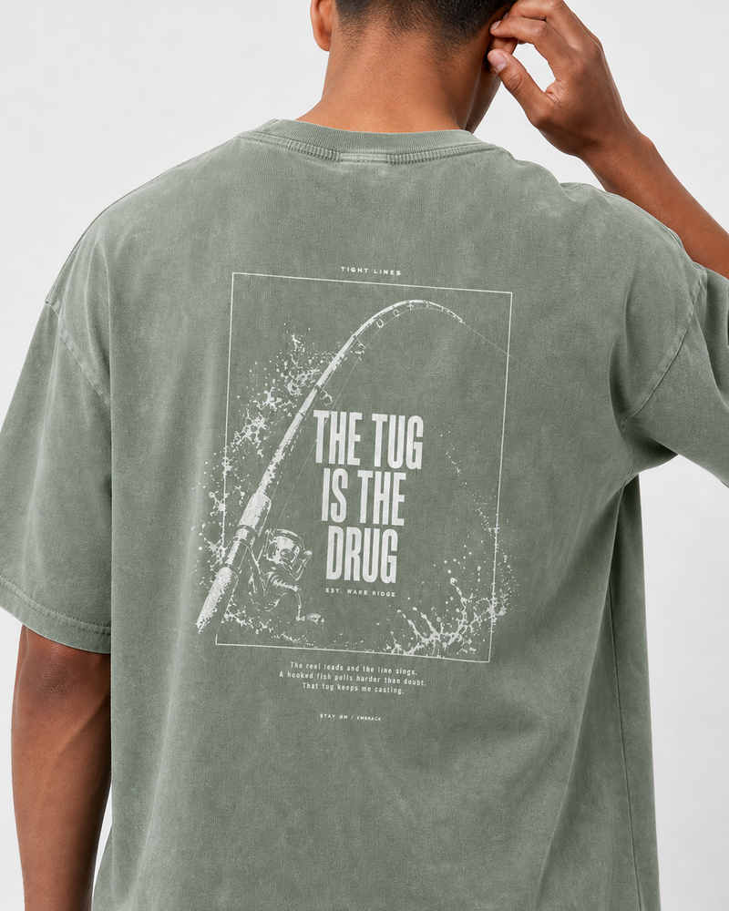 The Tug Is The Drug — Rod Under Load washed tee — washed sage, worn, side