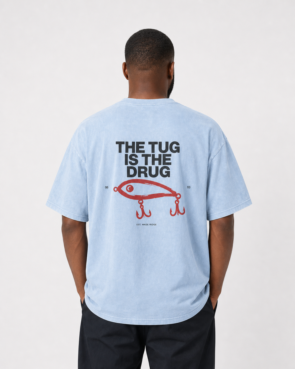 The Tug Is The Drug — Brushed Lure washed tee — washed light blue, worn, front