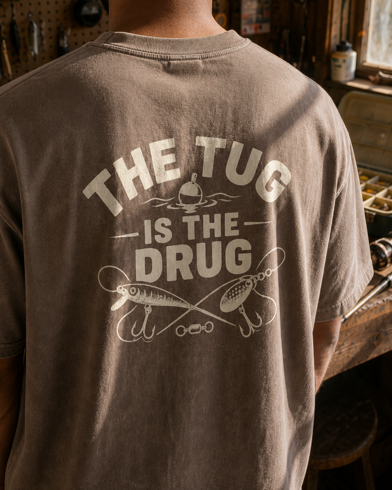 The Tug Is The Drug — Crossed Lures washed tee — washed coffee, worn, side