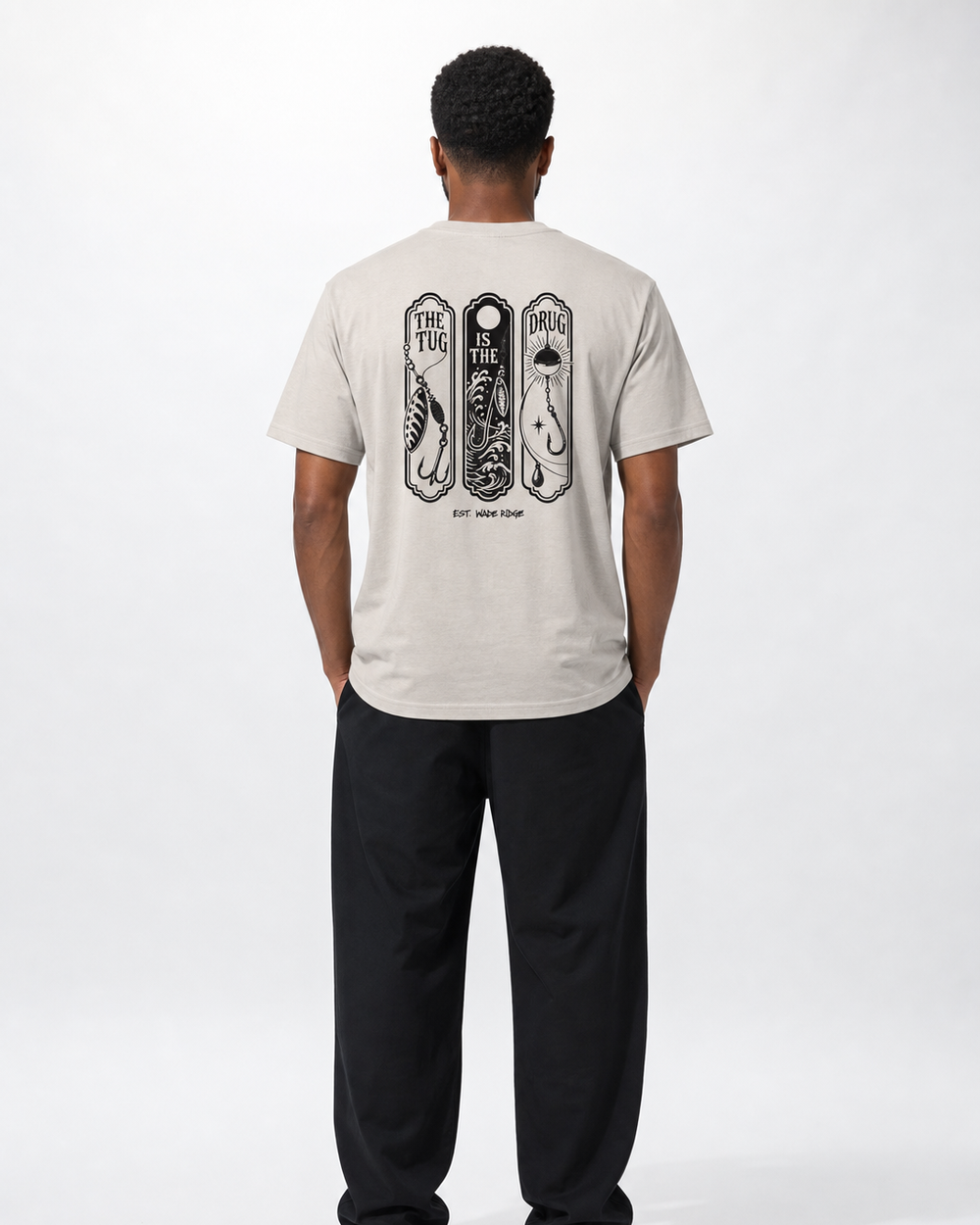 The Tug Is The Drug — Lure Panels tee — sand, worn, front