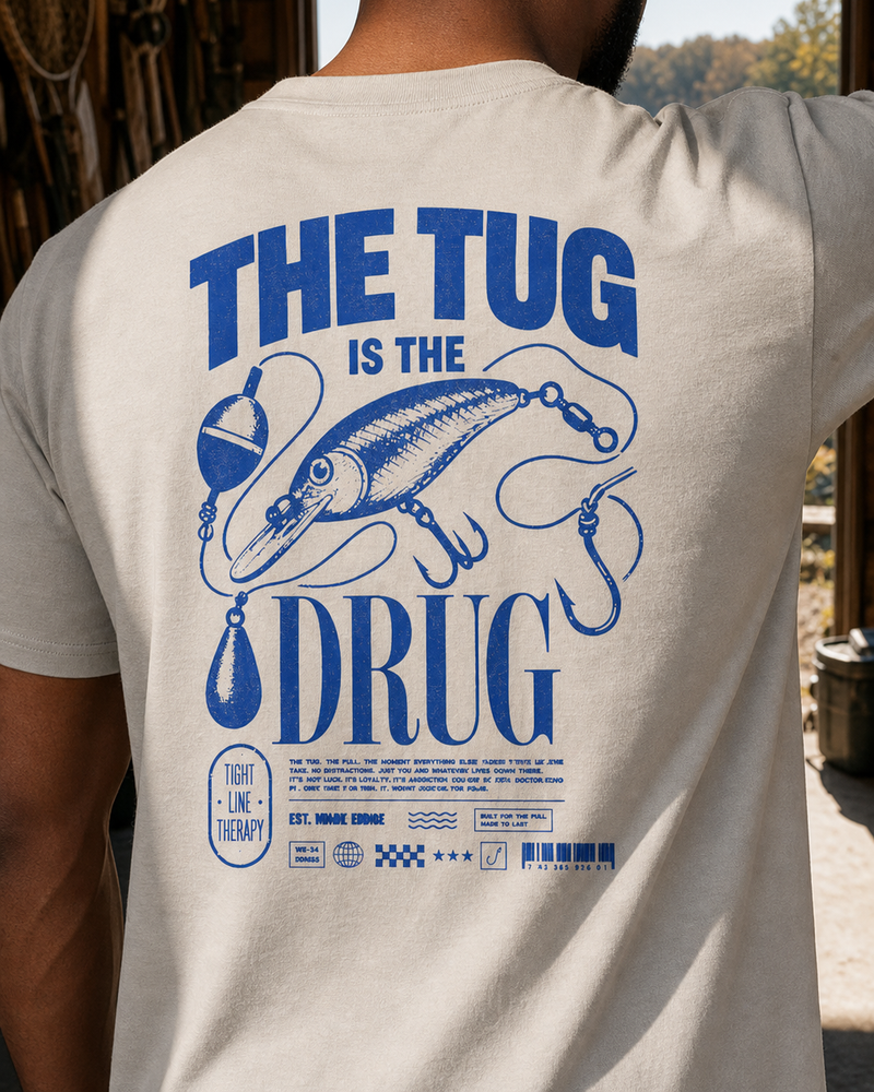 The Tug Is The Drug — Deep Diver tee — sand, worn, side