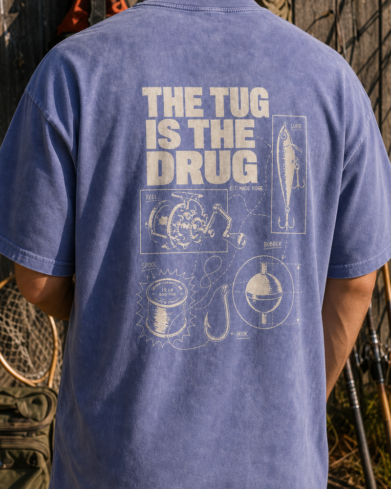 The Tug Is The Drug — Tackle Notes washed tee — washed blue, worn, side