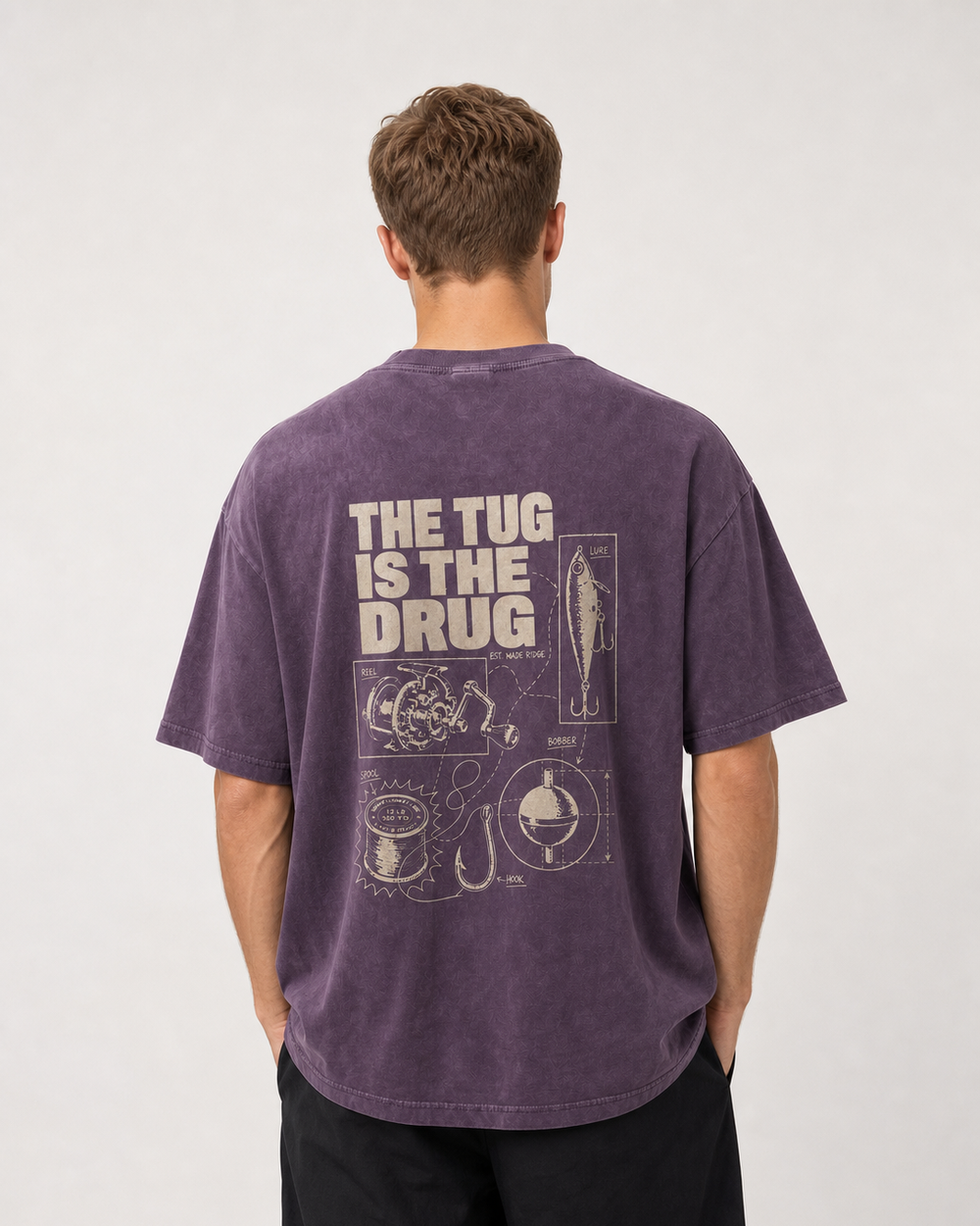 The Tug Is The Drug — Tackle Notes washed tee — washed violet, worn, front