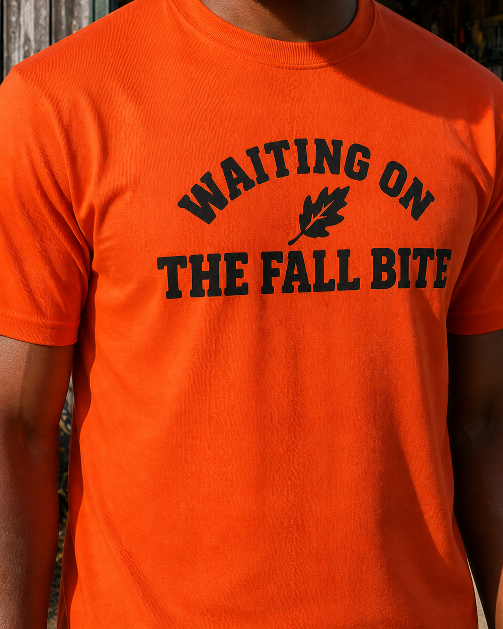 Waiting On The Fall Bite tee — orange, worn, side