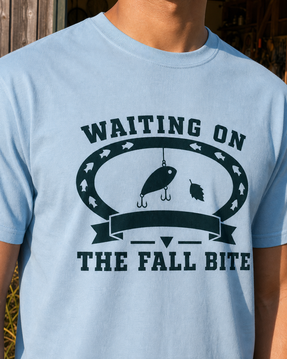 Waiting On The Fall Bite Heritage tee — light blue, worn, side